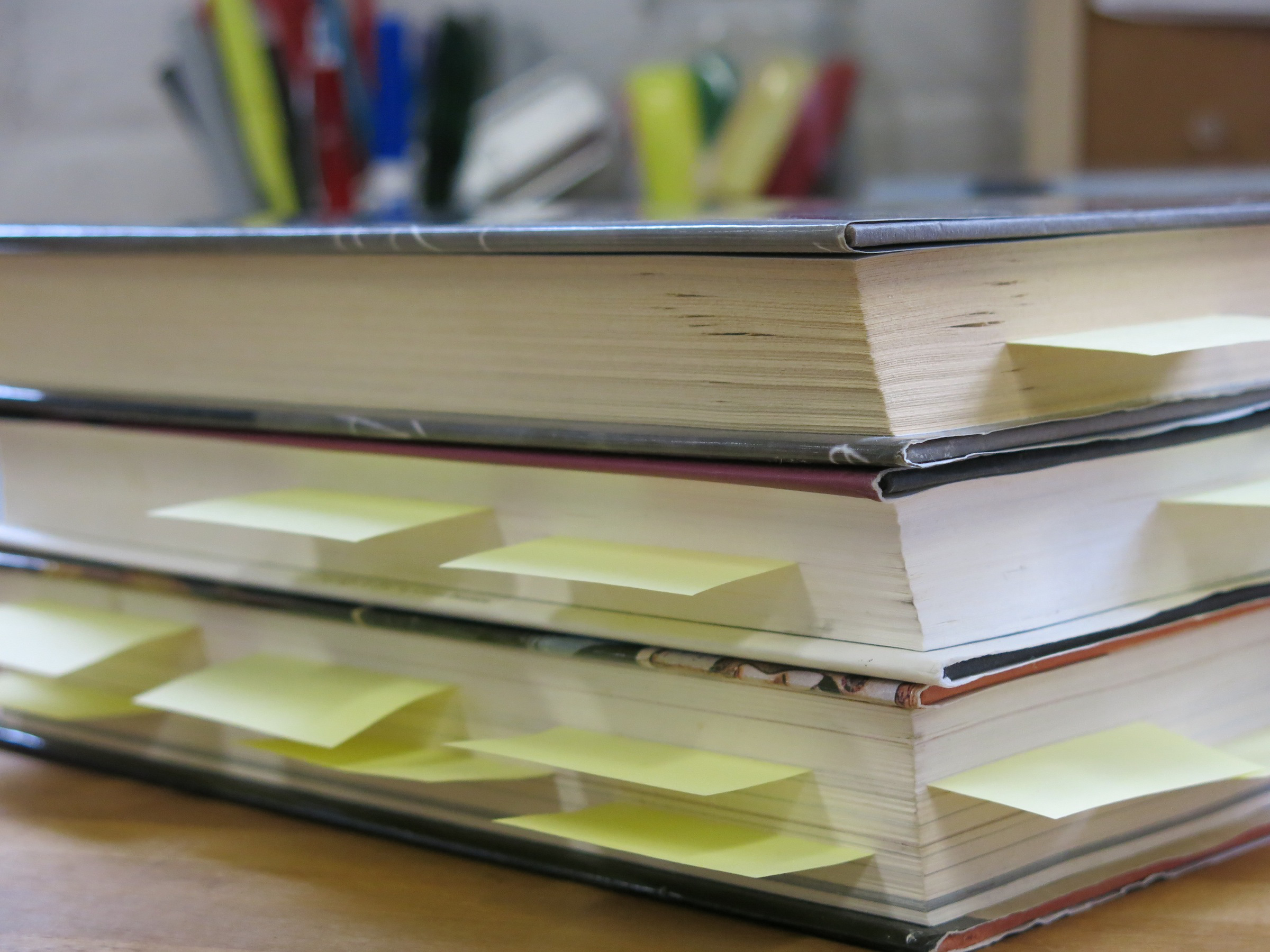 Sticky notes sticking out of novel pages